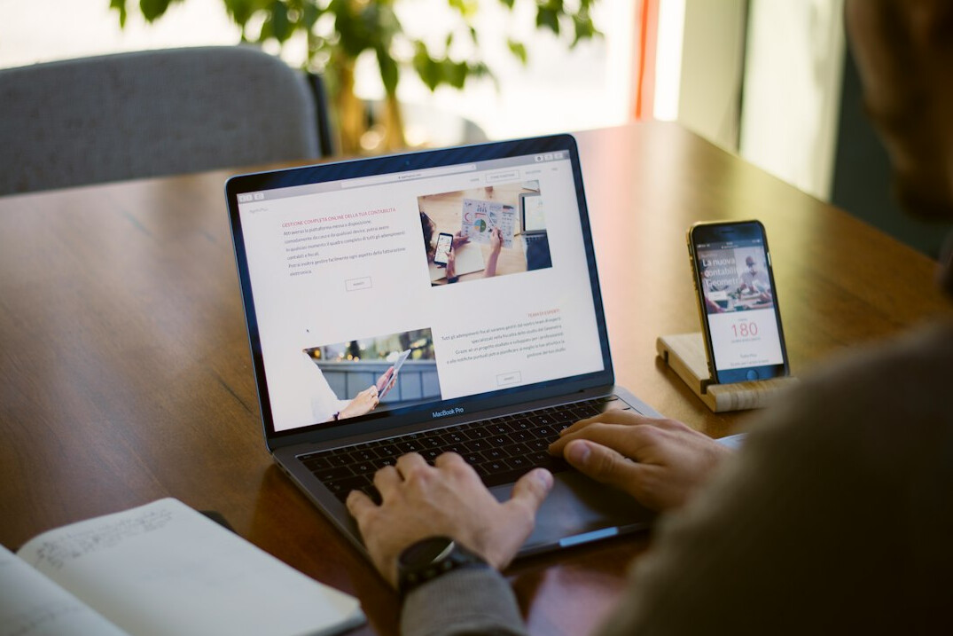 person using laptop for insurance